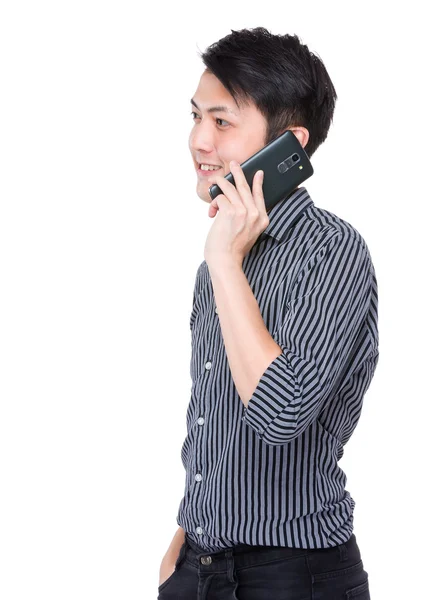 Young businessman talking on cellphone — Stock Photo, Image