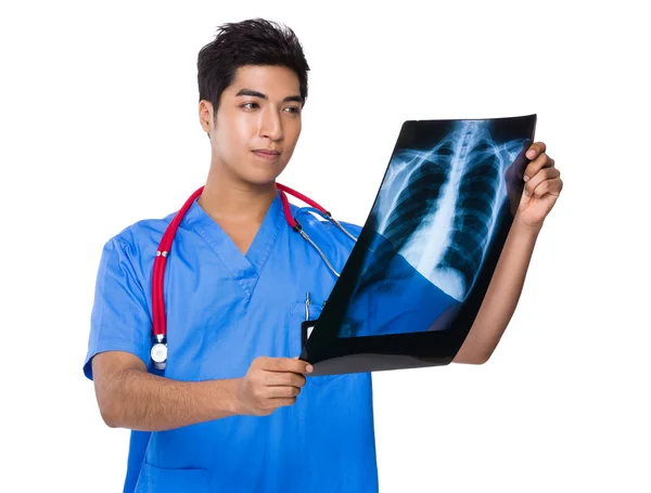 Doctor looking at x ray film — Stock Photo, Image