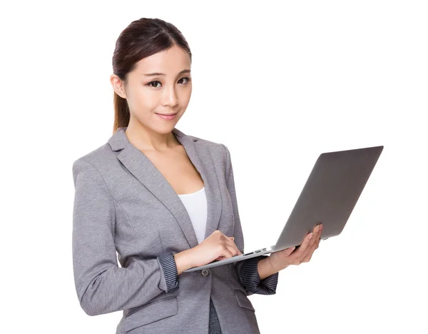 Businesswoman using laptop — Stock Photo, Image