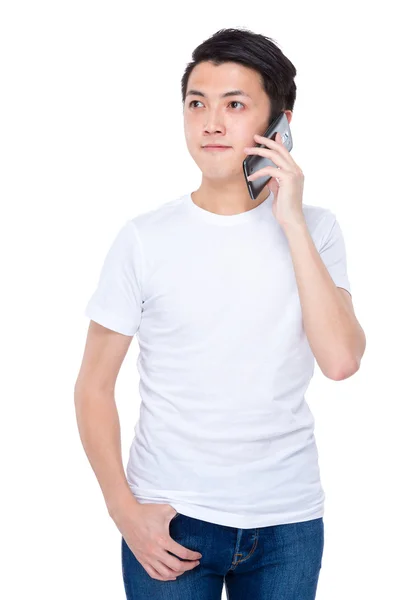 Young man talking on phone — Stock Photo, Image