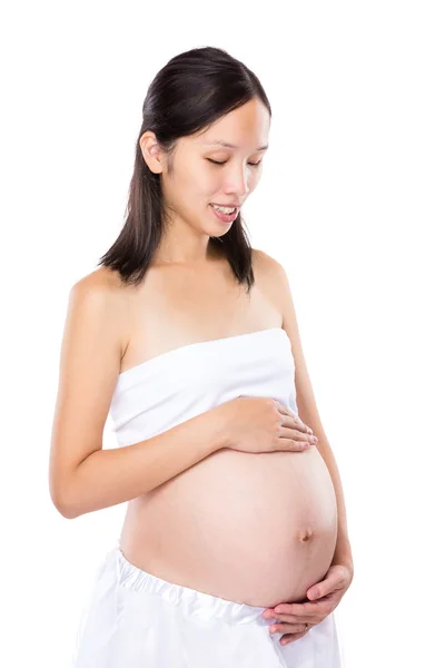 Asian Pregnant woman look at her tummy — Stock Photo, Image