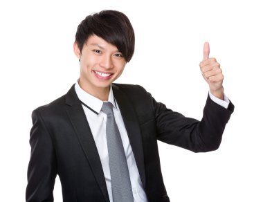 Baş parmağı havada bir iş adamı.