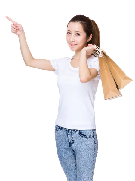 Femme avec sacs à provisions et doigt pointant vers le haut — Photo