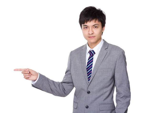 Businessman with finger point aside — Stock Photo, Image