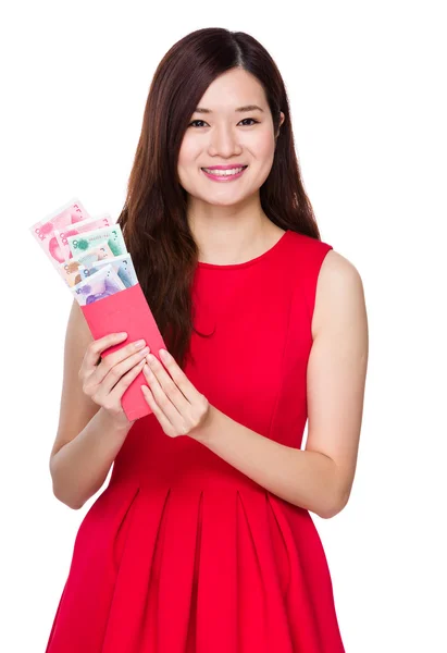 Woman holding pocket with RMB — Stock Photo, Image