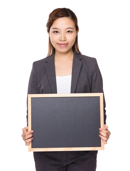 Businesswoman with chalkboard — Stock Photo, Image