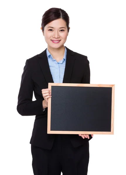 Businesswoman with chalkboard — Stock Photo, Image