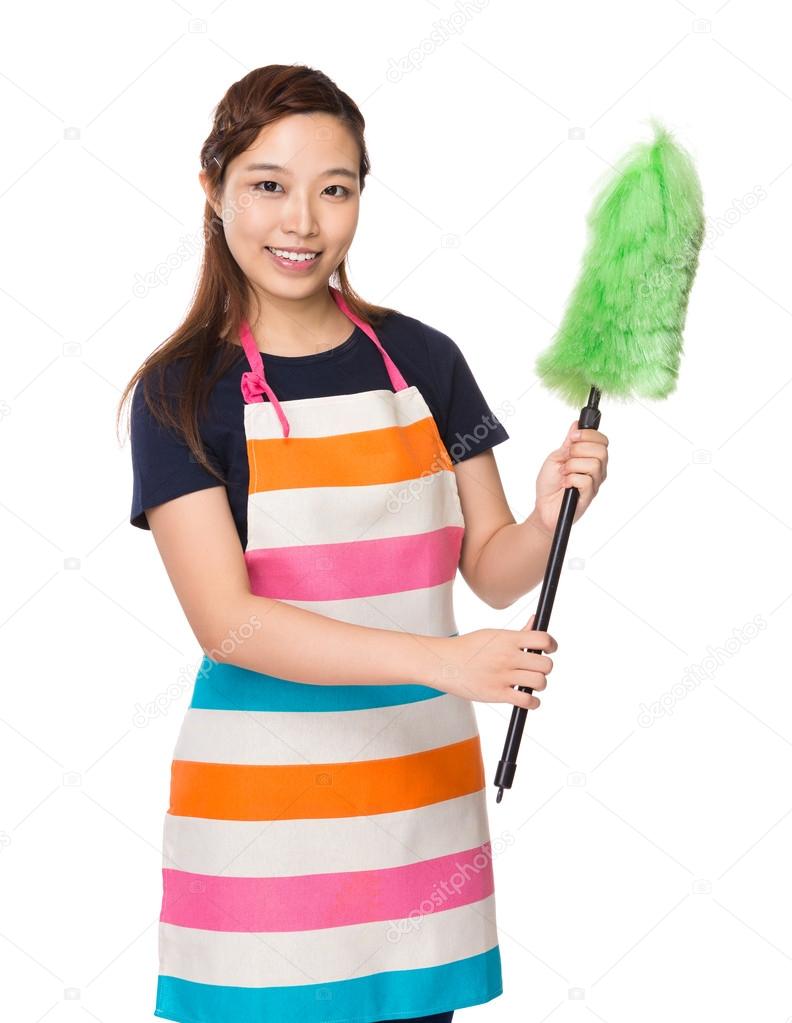 Housewife with cleaning brush