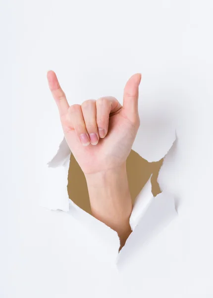 Female hand breaking paper wall — Stock Photo, Image