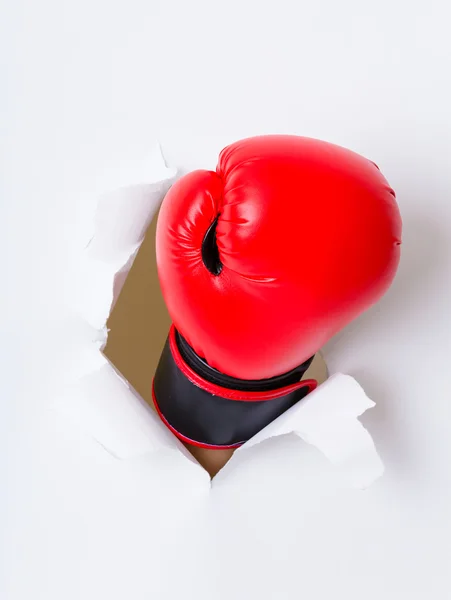 Luva de boxe através de papel — Fotografia de Stock