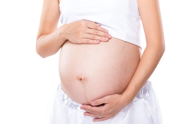 Zwangere vrouw raakt haar buik aan — Stockfoto