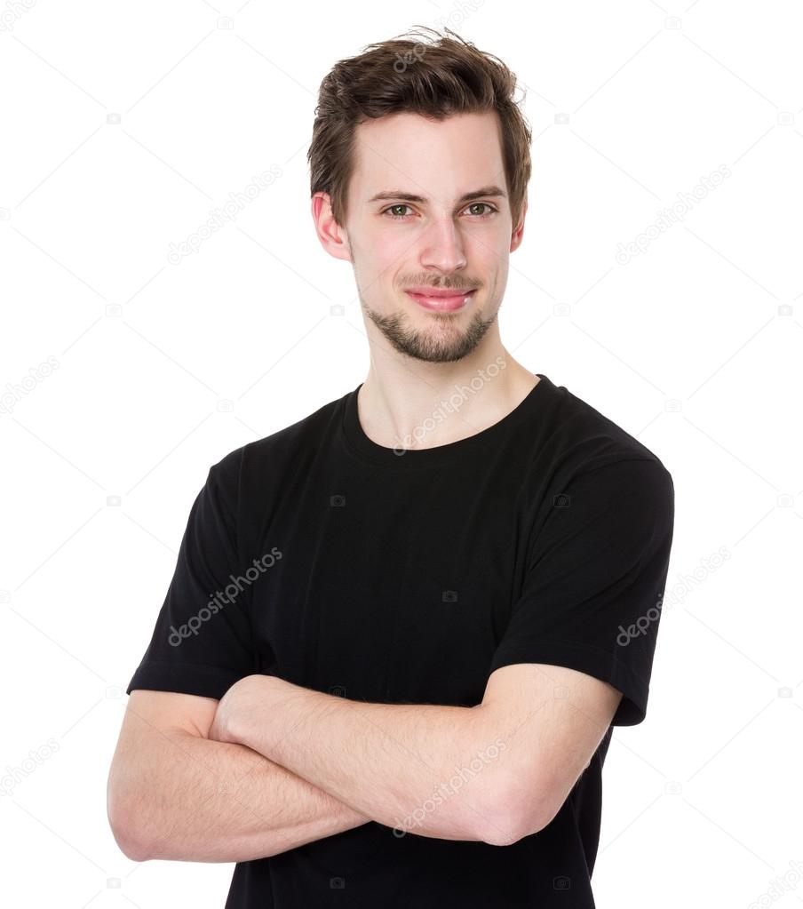 Man smiling with arms crossed
