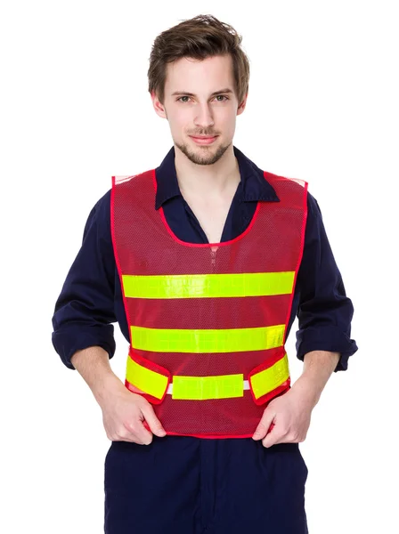 Smiling worker in a reflective vest — Stock Photo, Image