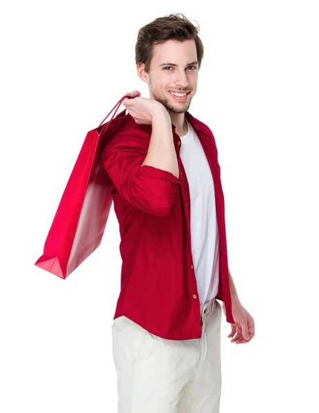 Ung vacker man i röd tröja — Stockfoto