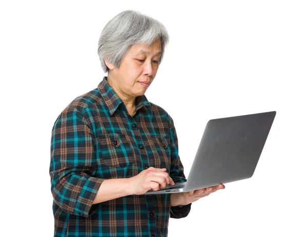 Asian mature woman in plaid shirt — Stock Photo, Image