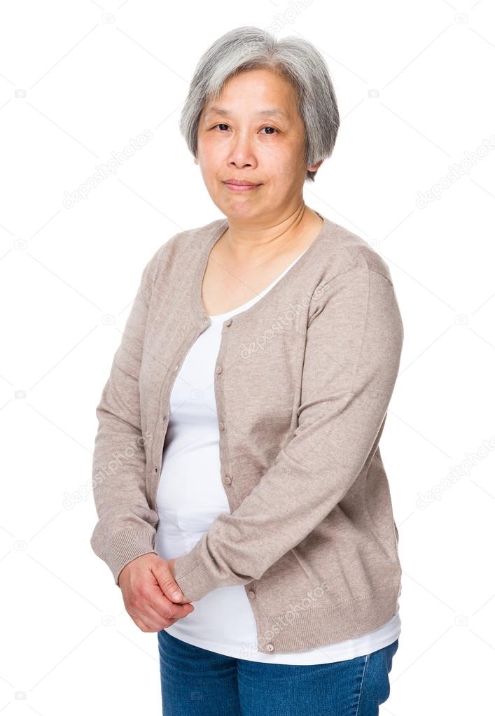 Asian mature woman in beige cardigan