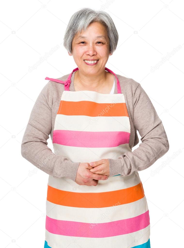 Asian elderly housewife in apron