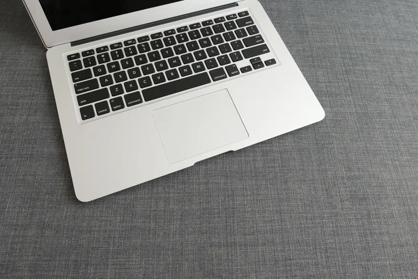 Laptop on the blue cloth — Stock Photo, Image