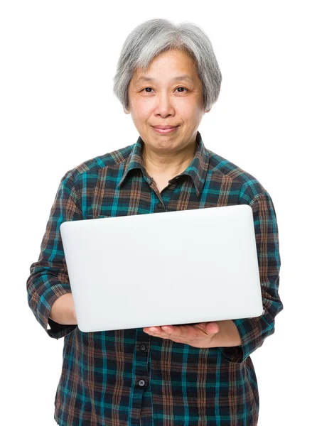 Asian mature woman in checkered shirt — Stock Photo, Image