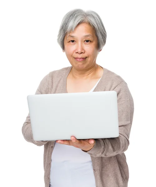 Asian mature woman in beige cardigan — Stock Photo, Image