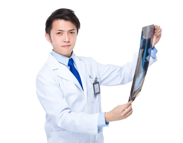 Asian doctor checking on x-ray image — Stock Photo, Image