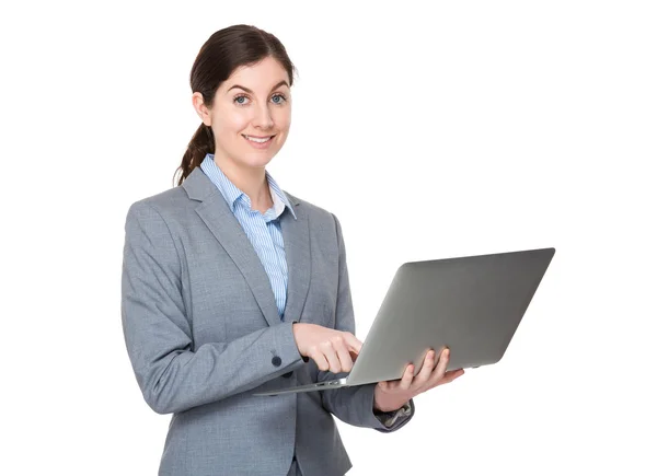 Caucasian young businesswoman in grey suit — Stock Photo, Image