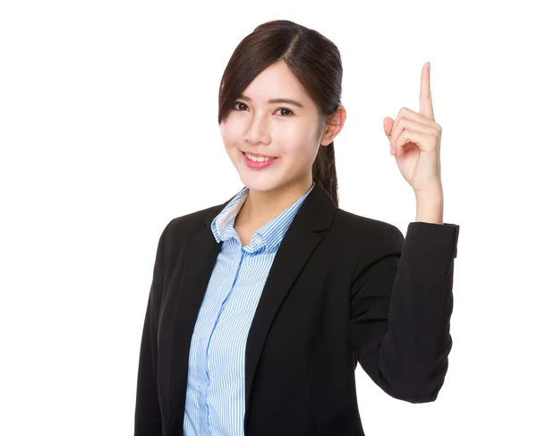 Businesswoman pointing upwards — Stock Photo, Image