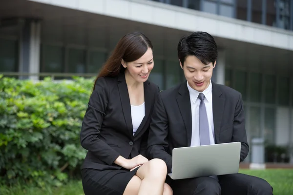 Asian young businesswoman and businessman — Stock Photo, Image