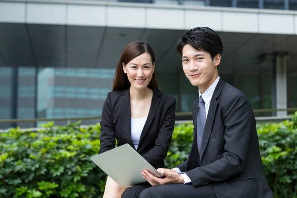 Asian young businesswoman and businessman — Stock Photo, Image