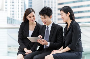 young Asian business team outdoors clipart