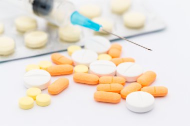Syringe and medical pills