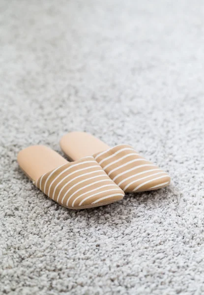 Slippers on grey carpet — Stock Photo, Image