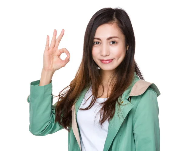 Asian young woman in green coat — Stock Photo, Image