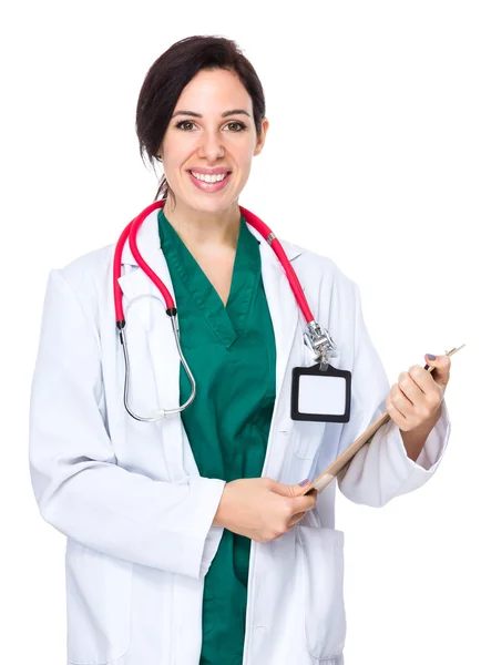 Female doctor holding clipboard — Stock Photo, Image