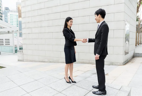 Asian businesswoman hand shaking with businessman — Stock Photo, Image