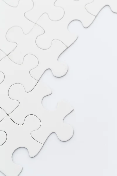 Plain white jigsaw puzzle — Stock Photo, Image