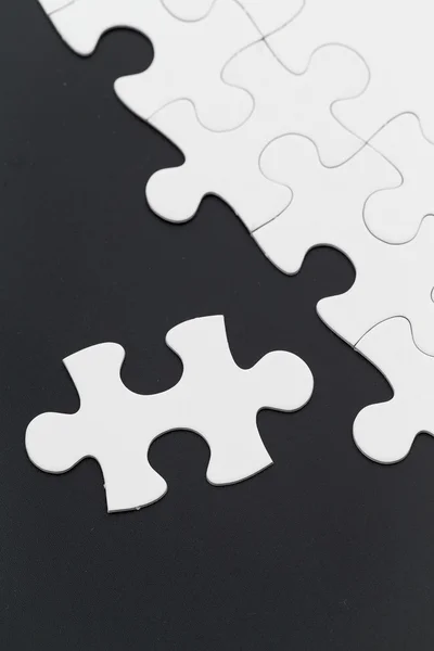 Plain white jigsaw puzzle — Stock Photo, Image