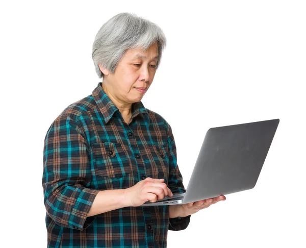 Asian old woman in checkered shirt — Stock Photo, Image