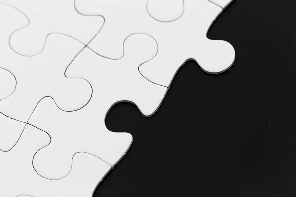 Plain white jigsaw puzzle — Stock Photo, Image