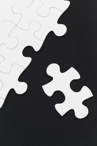 Plain white jigsaw puzzle — Stock Photo, Image