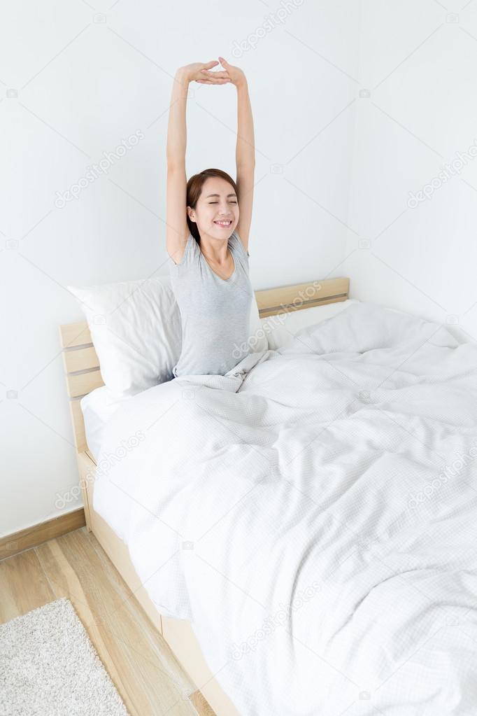 Young asian woman on bed