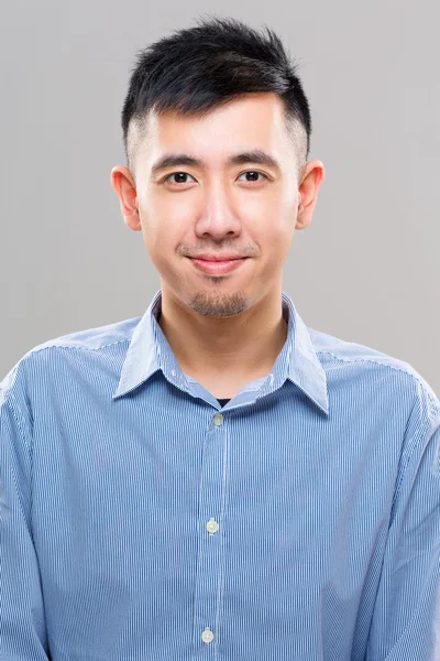 Young asian man in blue shirt — Stock Photo, Image