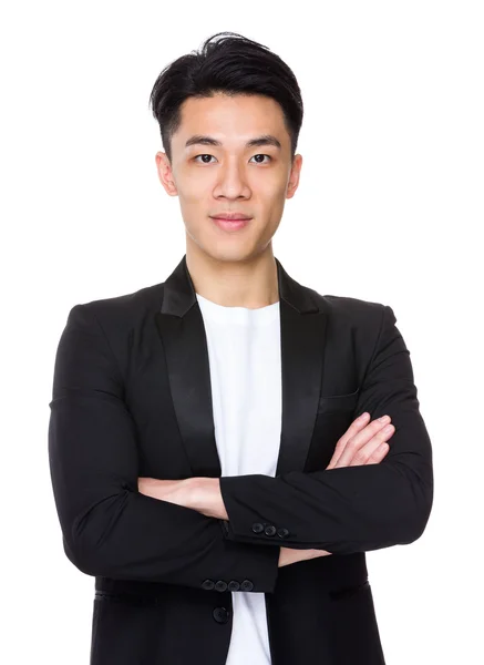 Jonge Aziatische zakenman in zwarte jas — Stockfoto