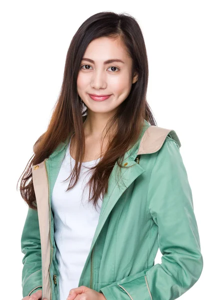 Asian young woman in green coat — Stock Photo, Image