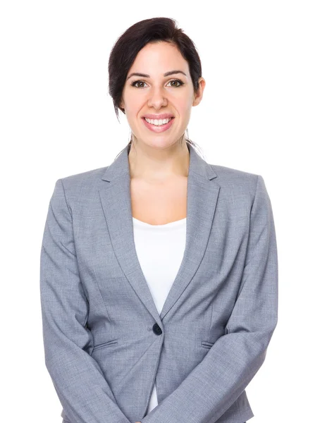 Beautiful brunette businesswoman in business suit — Stockfoto