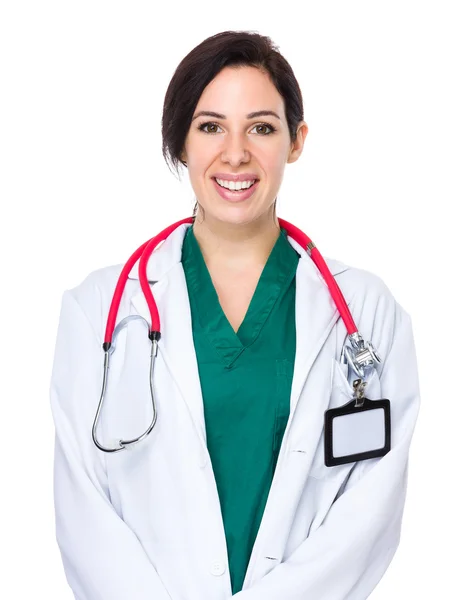 Brünette Ärztin im weißen Mantel — Stockfoto