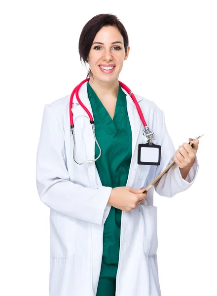 Brunette woman doctor in white coat — Stockfoto