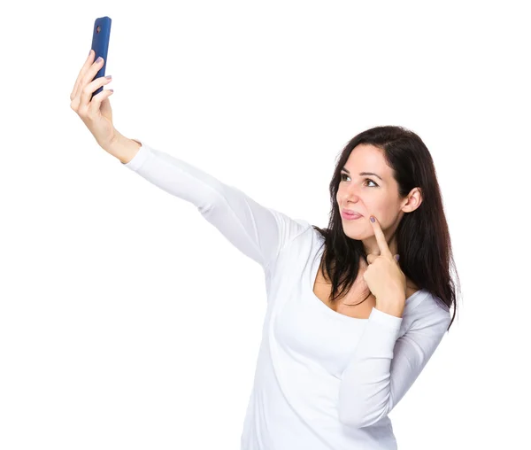 Beautiful brunette woman in white sweater — Stock Photo, Image