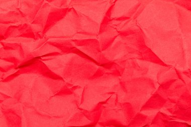 Red crumpled paper sheet