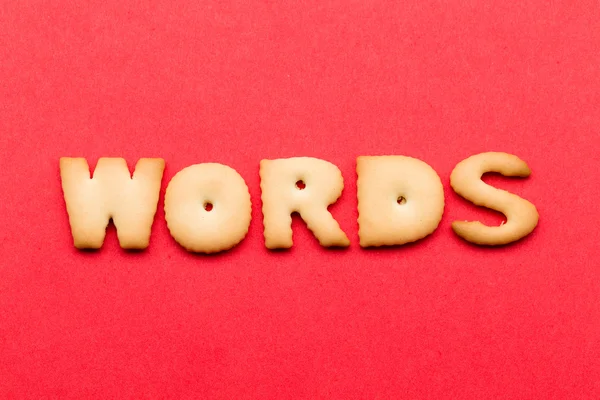 Words biscuit over the red background — Stock Photo, Image